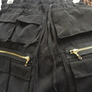 Vivienne Tam black mini with pockets/gold zippers